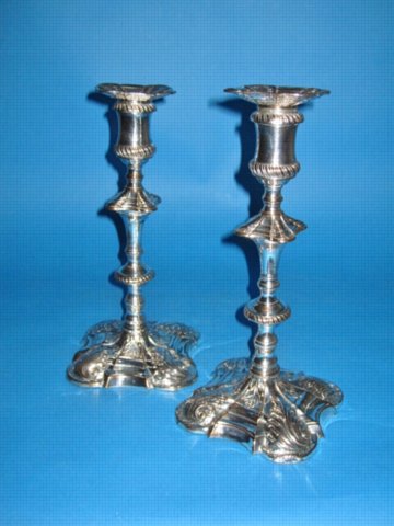 A PAIR OF GEORGE III CANDLESTICKS BY TUDOR & CO., CIRCA 1765 - Click to enlarge and for full details.