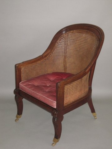 REGENCY MAHOGANY BERGERE LIBRARY CHAIR. - Click to enlarge and for full details.