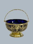 A GEORGE III IRISH SILVER GILT SWING HANDLED SUGAR BASKET, CIRCA 1790  - Click to enlarge and for full details.