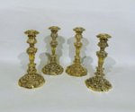 ​A RARE SET OF FOUR GEORGE IV SILVER GILT CANDLESTICKS. FENTON, ALLANSON AND MACHON SHEFFIELD 1824 AND 1826.  - Click to enlarge and for full details.
